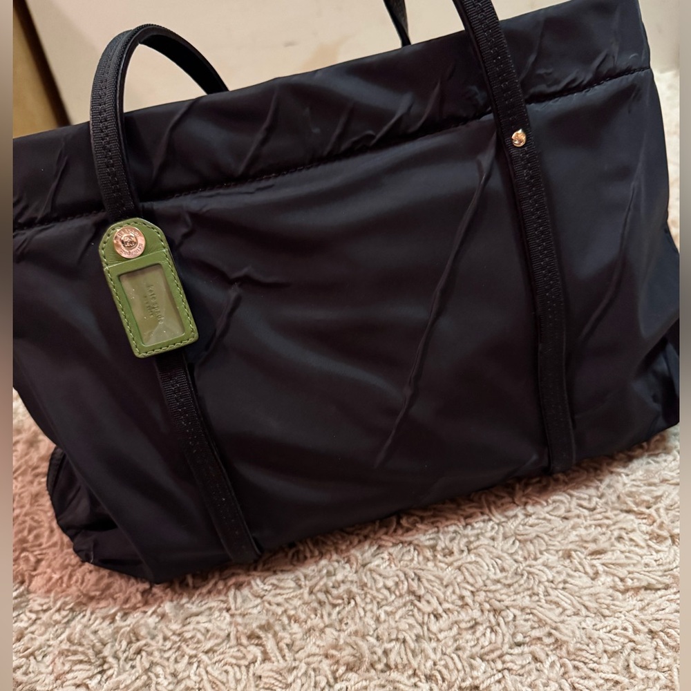 Kate Spade black purse, green with black polka dot interior.